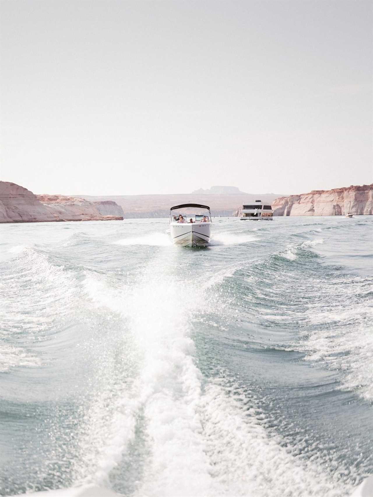 A boat carrying people to and from a yacht.