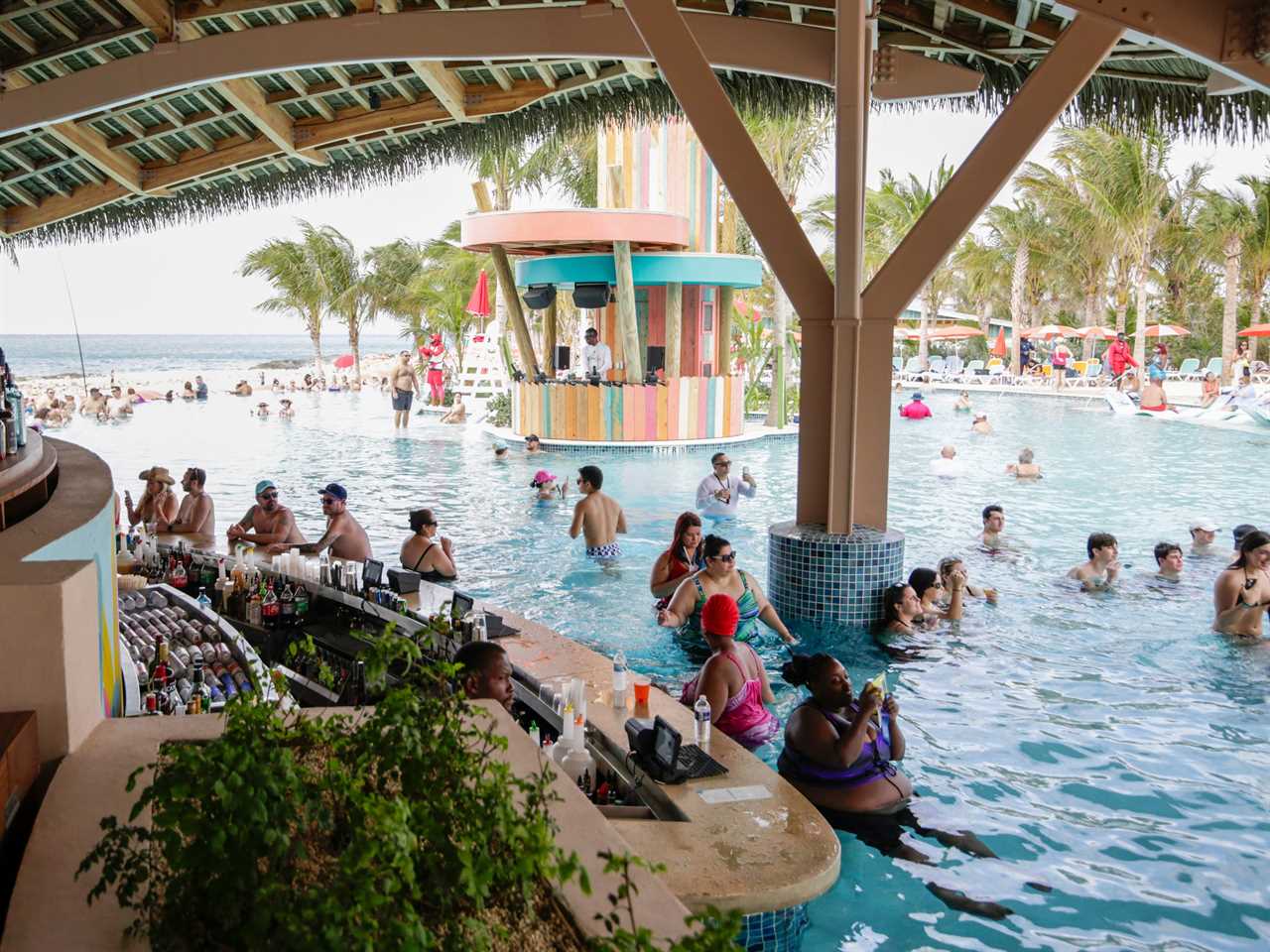 Hideaway Beach swim-up pool bar with people