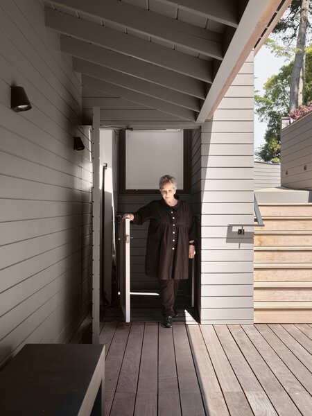 To prepare for the day she can longer use stairs, Roberta installed a lift that connects the garage with the entry garden. It’s concealed with a door that matches the home’s siding.