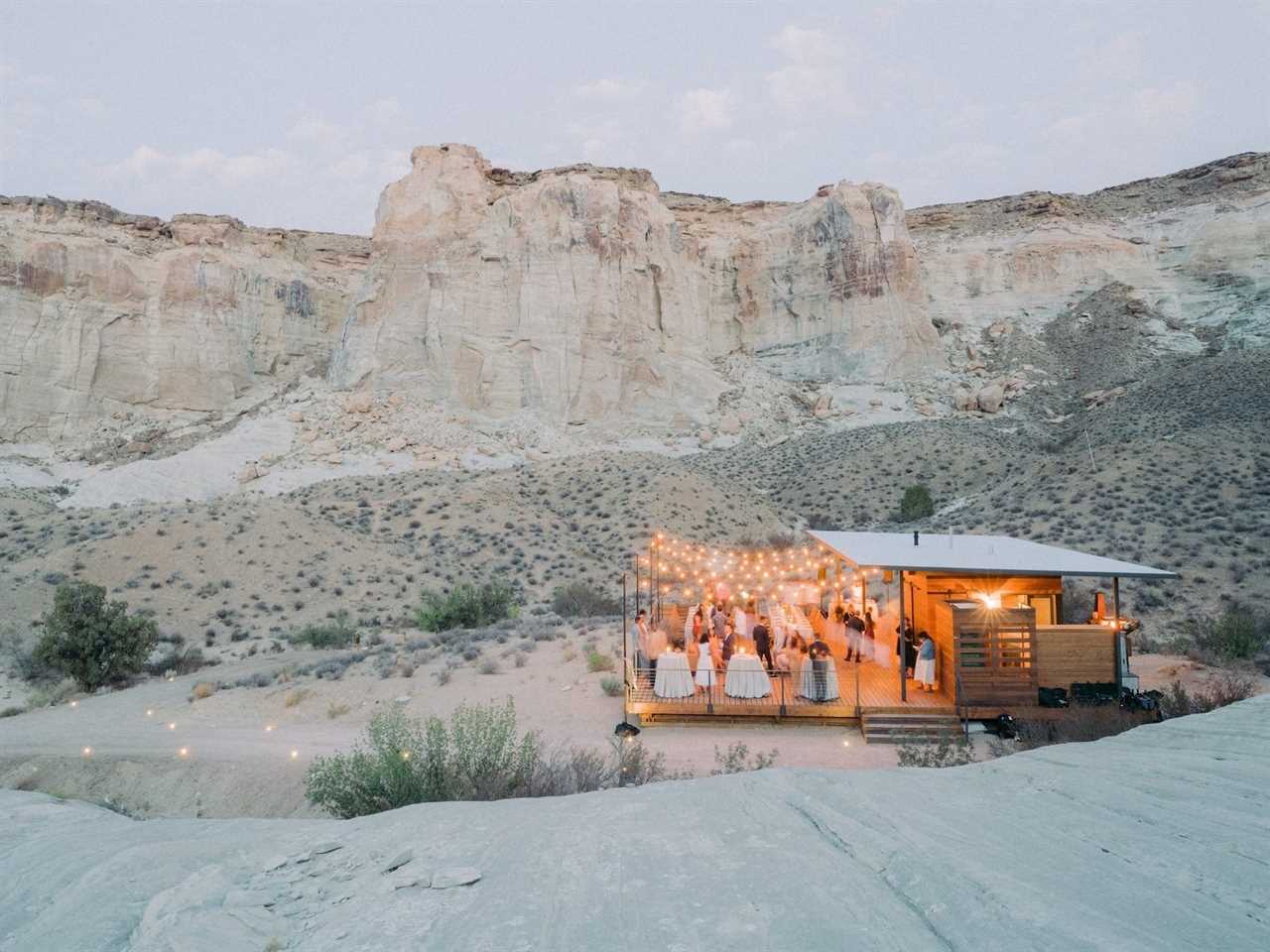 A wedding party on a patio in the desert.