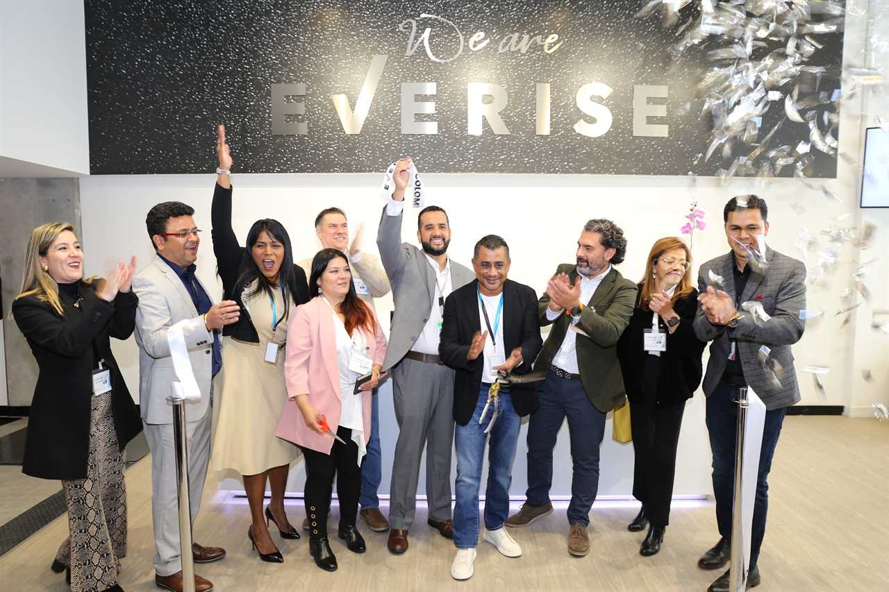 Sudhir Agarwal (fourth from right), celebrates at the opening of Everise's office in Bogota, Colombia.