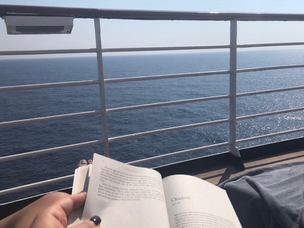 someone reading on a cruise ship deck