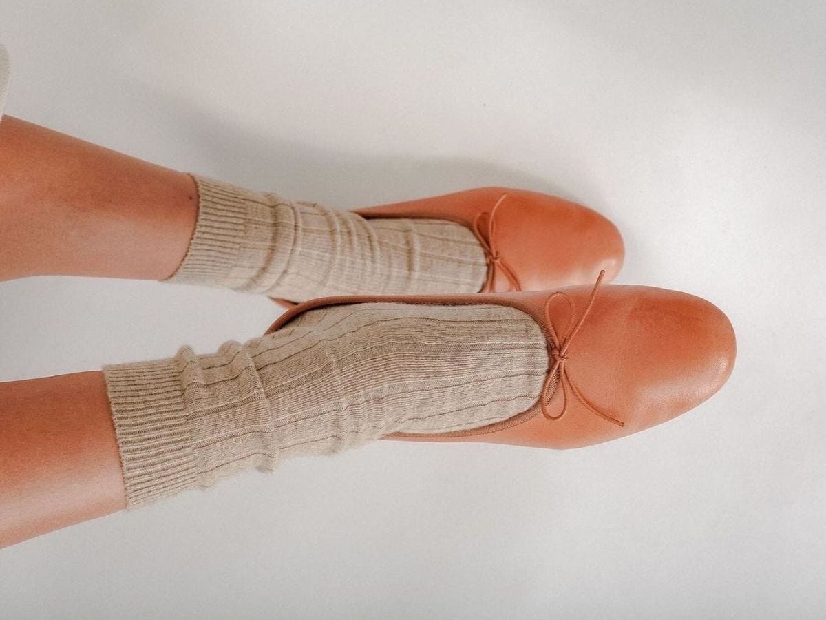 Tan Mansur Gavriel Dream Ballerina ballet flats worn with tan socks on model.