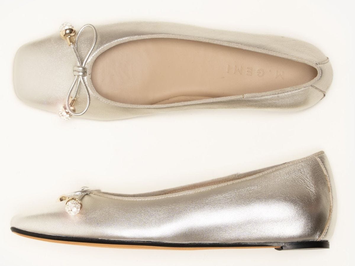 Silver ballet flats with crystal adorned bow details.