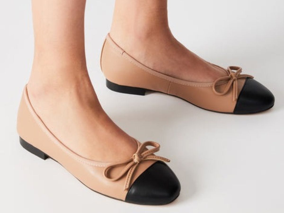 Black toe cap beige ballet flats.