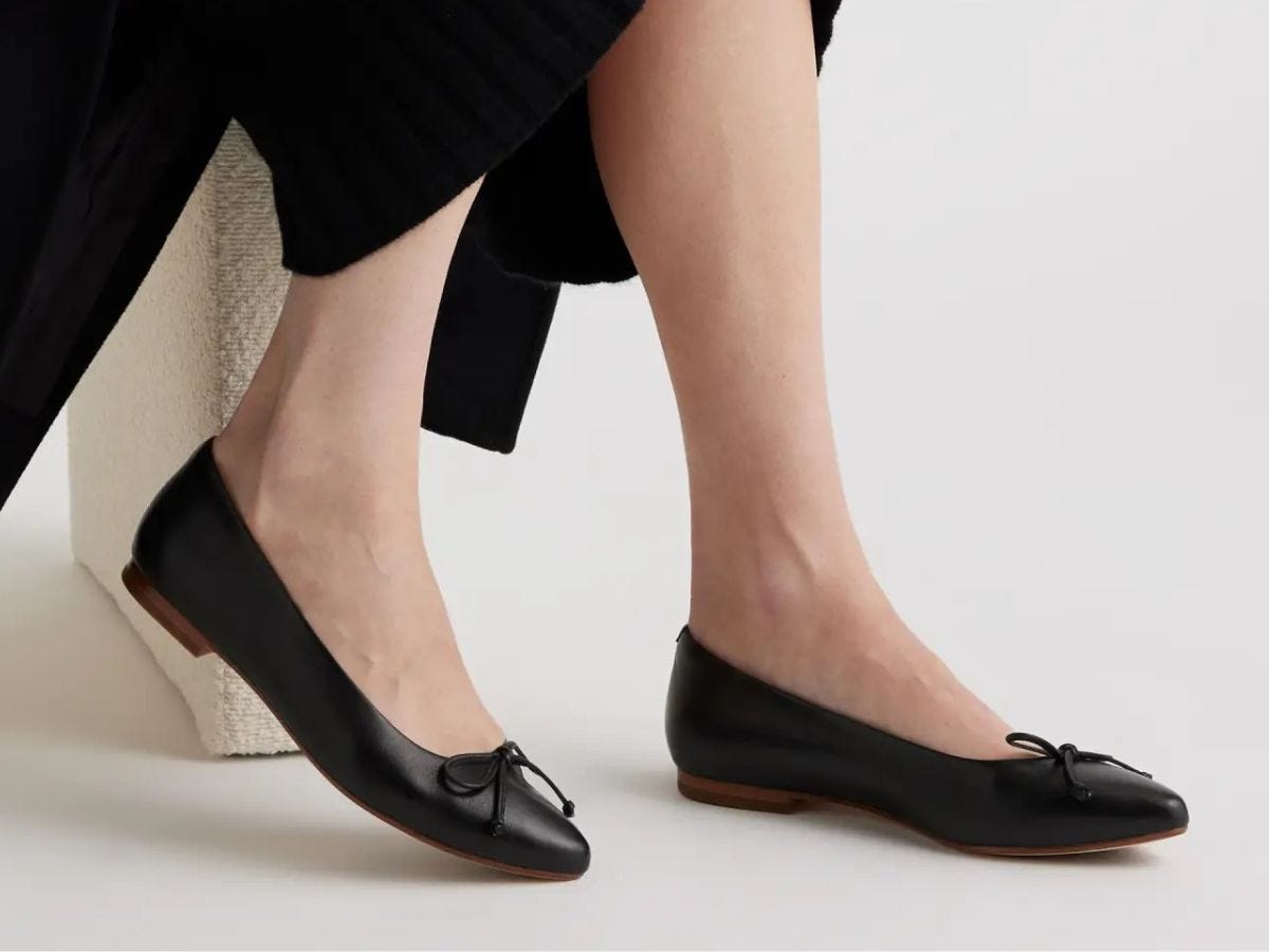 Black Quince pointed toe ballet flats on model.