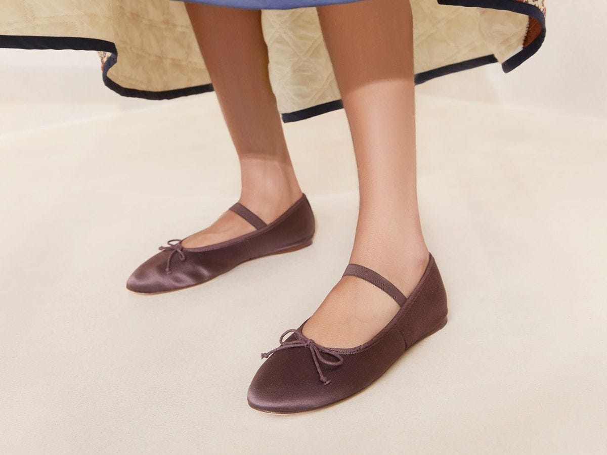 Brown satin Loeffler Randall Leonie ballet flats on model.