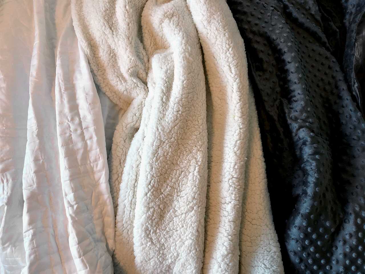 A collection of weighted blankets together.