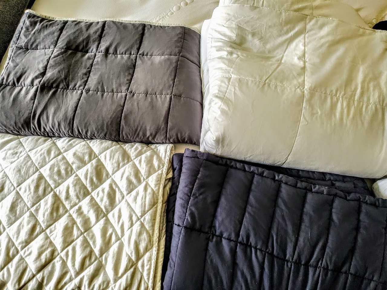 Four weighted blankets folded up.