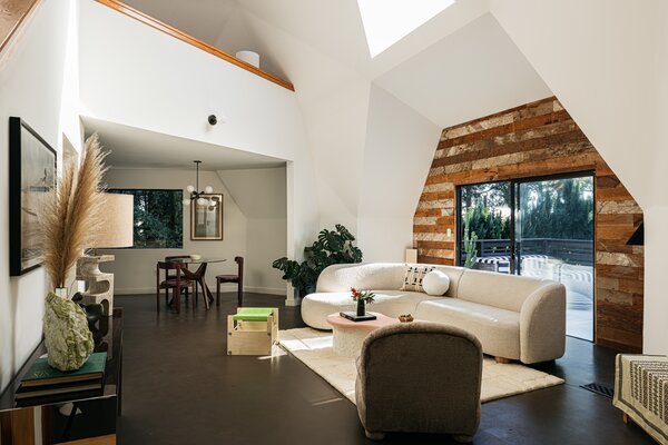 The two-level home is nestled among thick vegetation on Mount Washington.