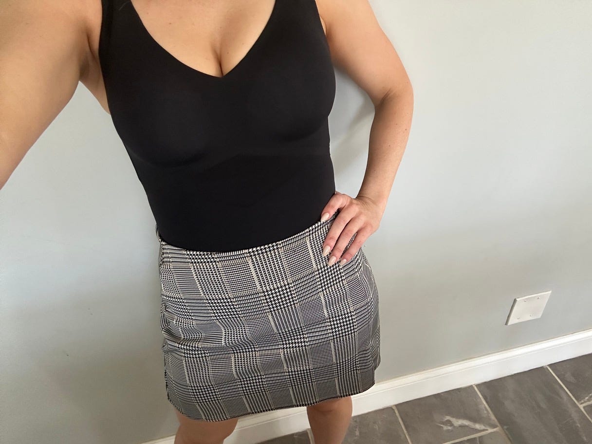 selfie of bodysuit and plaid skirt