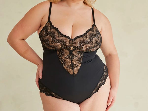 Model wearing a black Pinsy Sculpting Lace Shapewear Bodysuit.