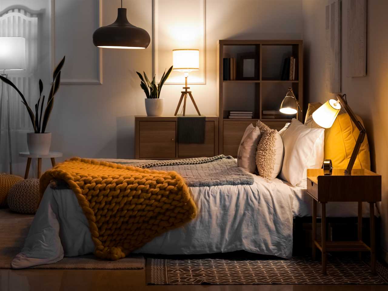 bedroom with lots of different lamp lighting options and yellow decor features