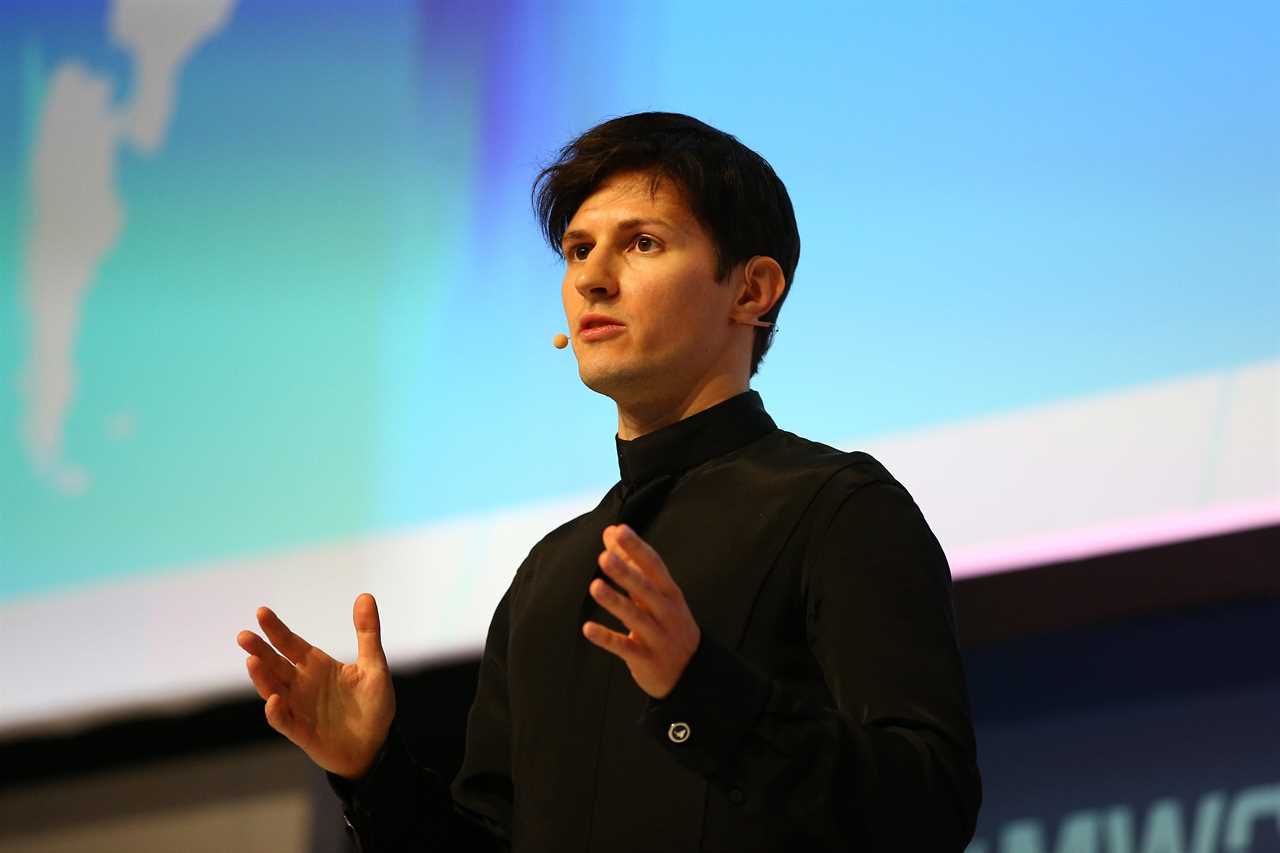 Pavel Durov with a microphone on a stage