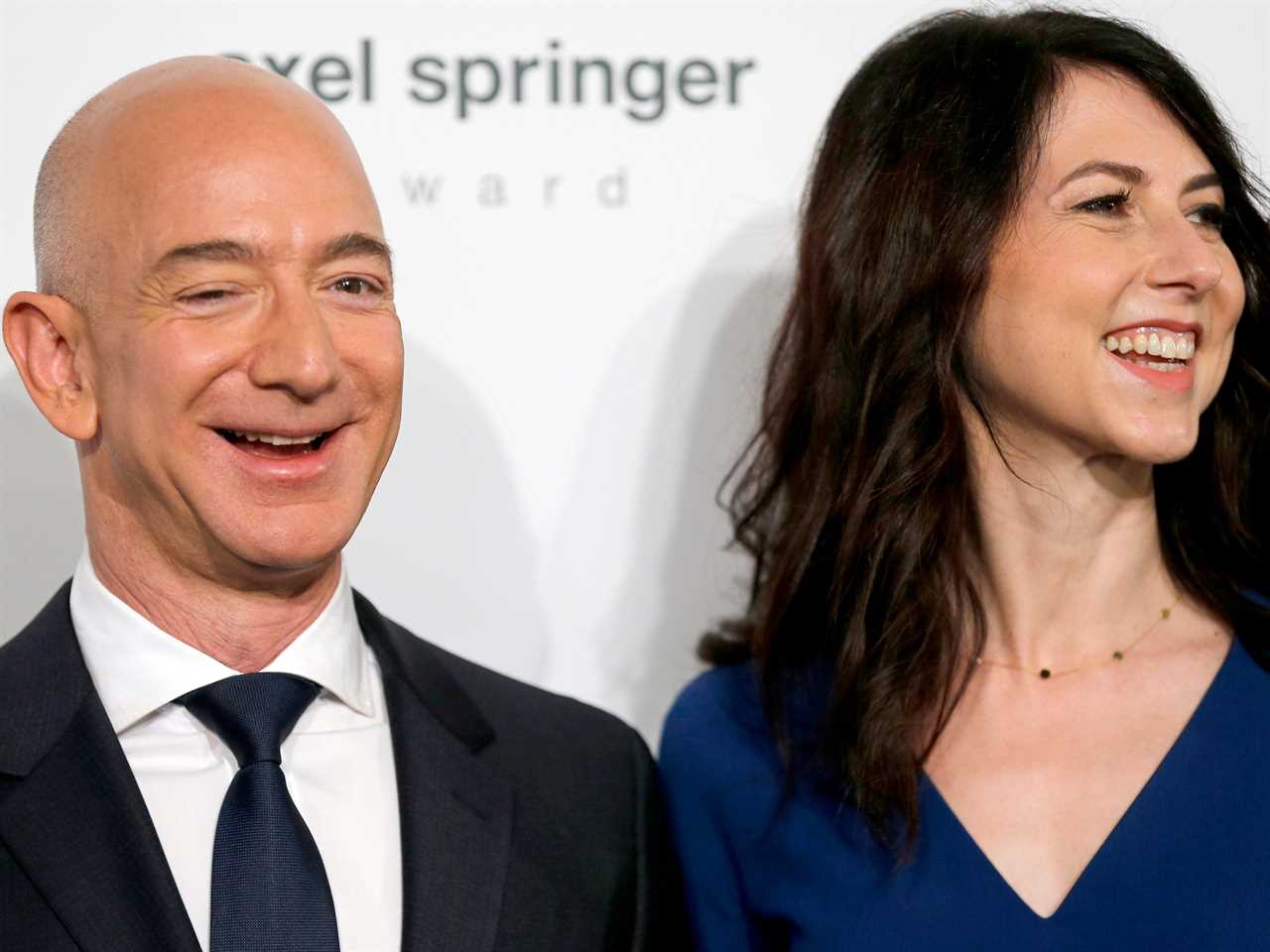 mackenzie scott is pictured smiling to the right of jeff bezos