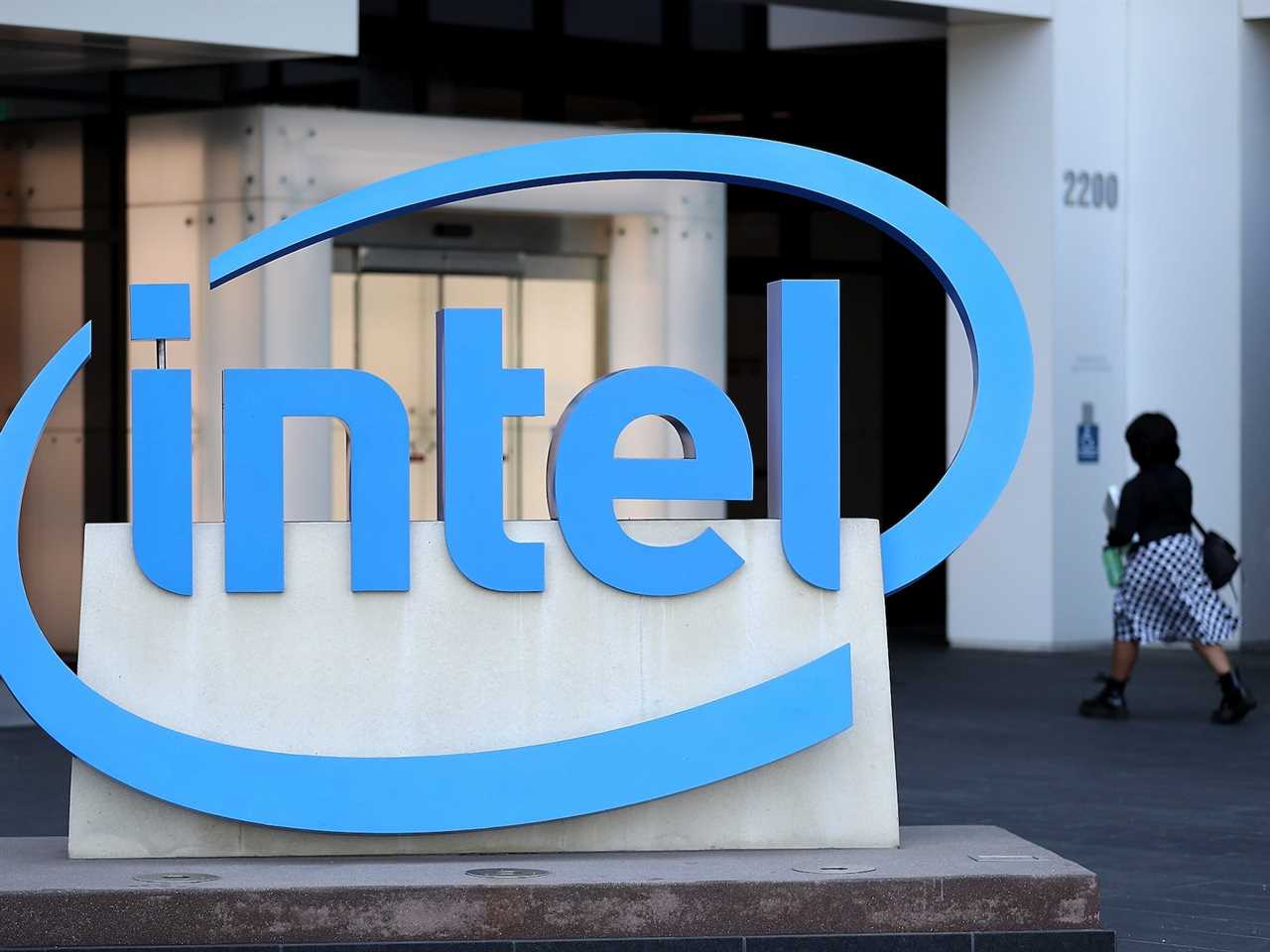 Intel logo and a person walking in the background