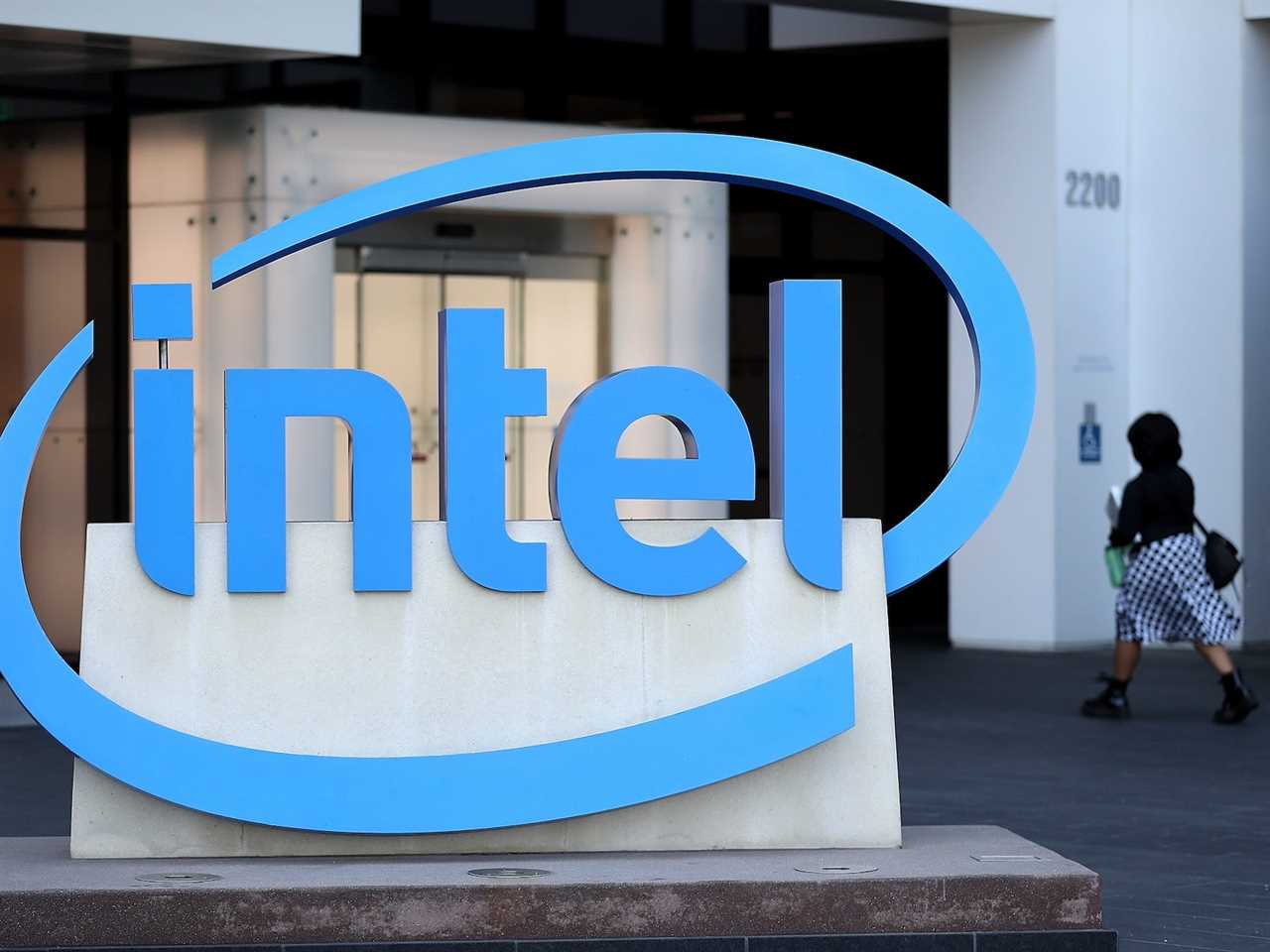 Intel logo and a person walking in the background