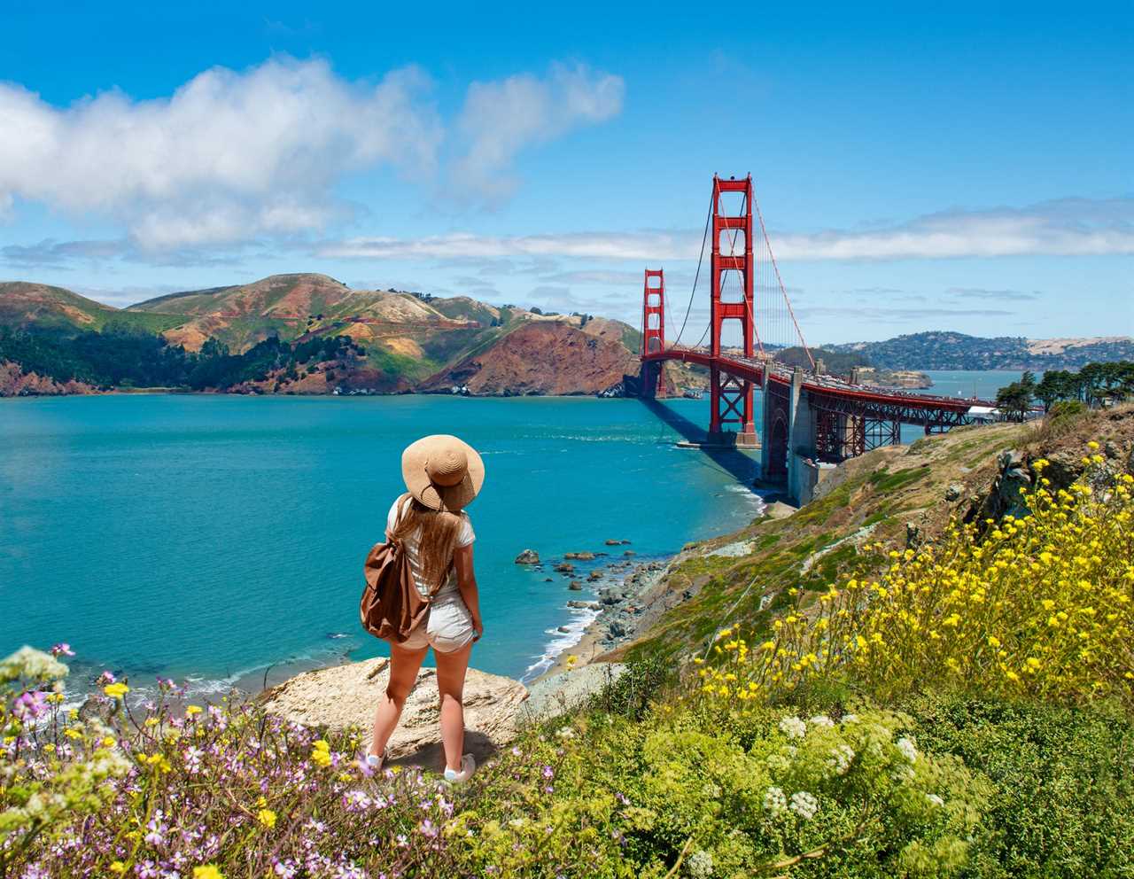 A woman overlooking the Golden Gate Bridge in San Francisco, California