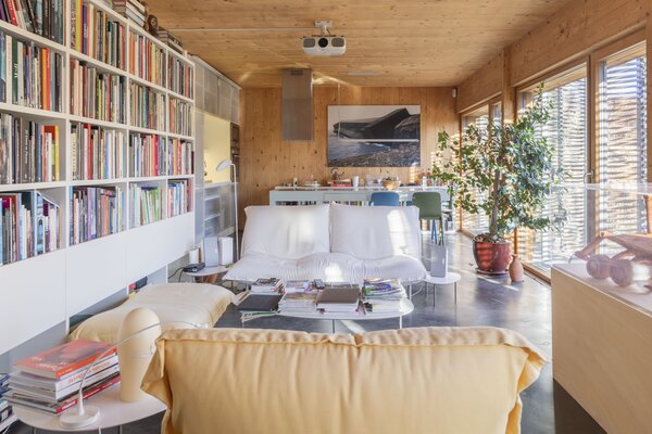 Wood-clad walls span across the main living areas, creating a soft and warm atmosphere.