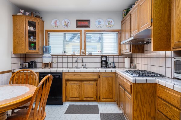 BEFORE: The kitchen featured vintage cabinets and black and white tile.