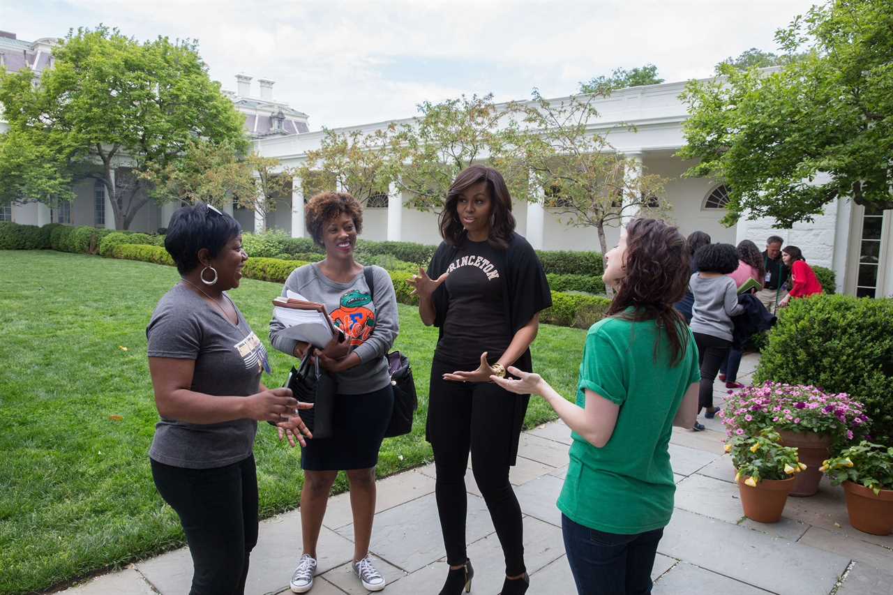 Clayton with Michelle Obama and colleagues in the Rose Garden before a 2016 College Signing Day event.