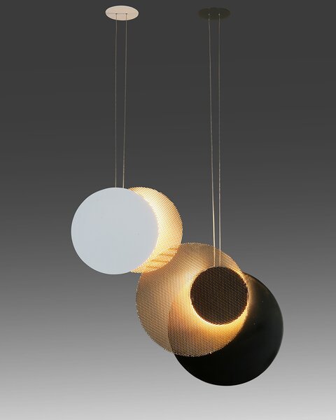 Spain design studio MYO’s Eclipse lighting is composed of a central disc with a magnetic system and two external discs—one made with a special MYO mesh material, the other made of steel—that diffuse and reflect the light, respectively.