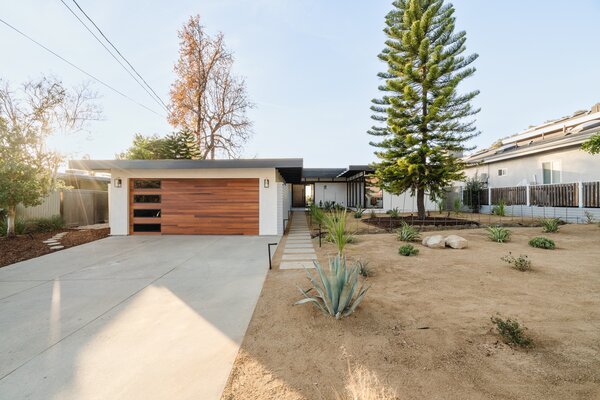 The fenced-in, one-story home sits far back off the street, enhancing the sense of privacy.