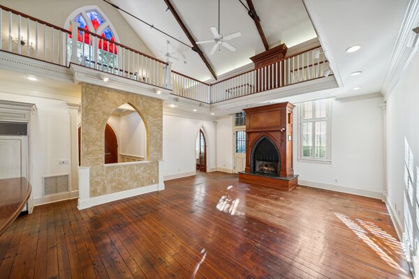 A wraparound mezzanine overlooks the main living area and kitchen on the ground floor.