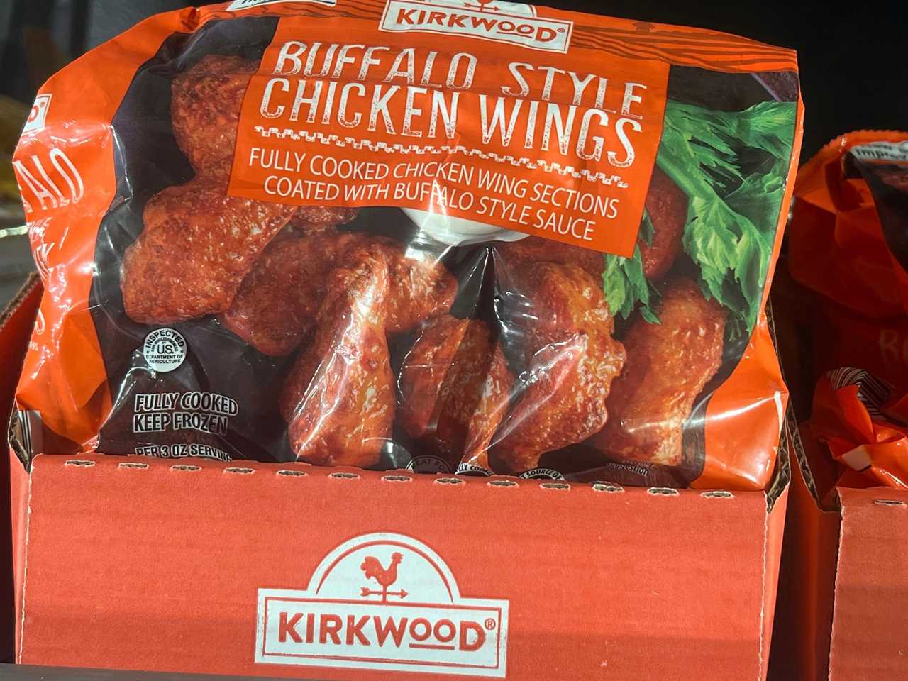 Kirkwood Buffalo-style chicken wings in an orange bag with images of chicken on the bag