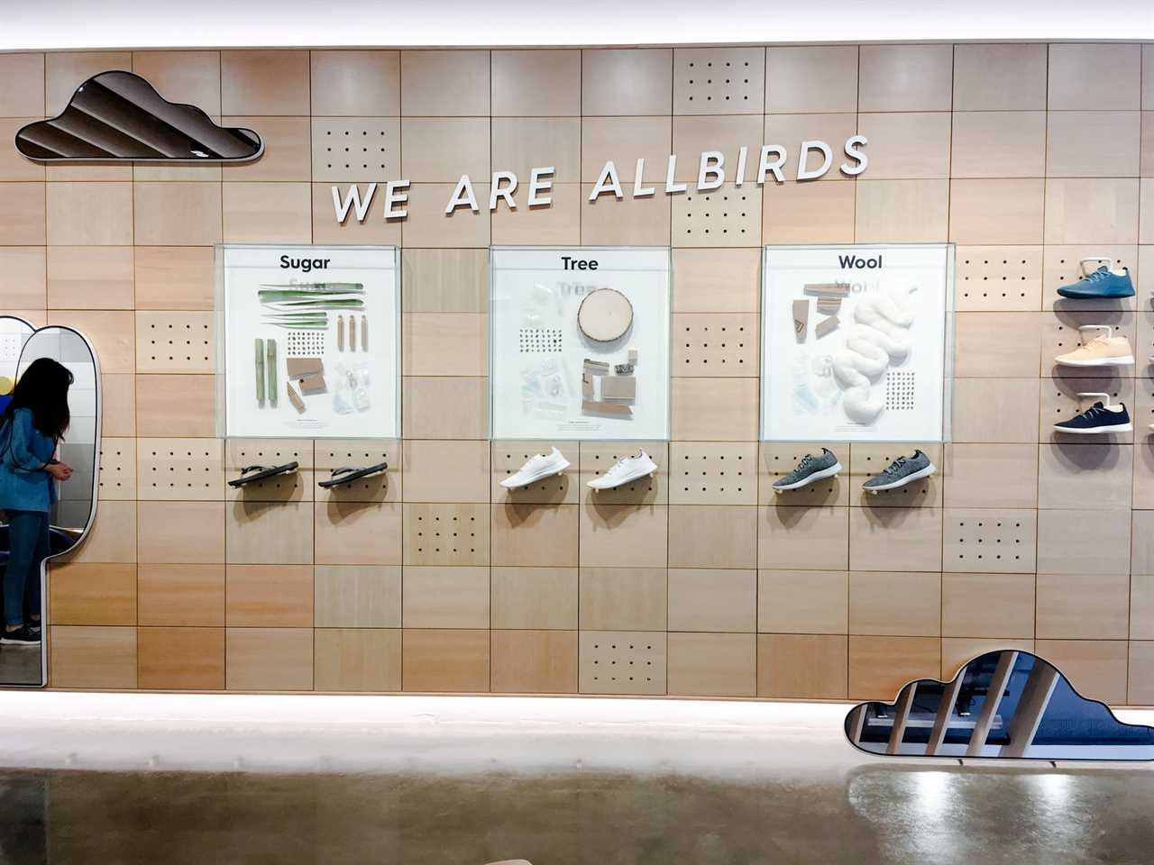 A wall with sneakers on display in the Allbirds store in Soho.