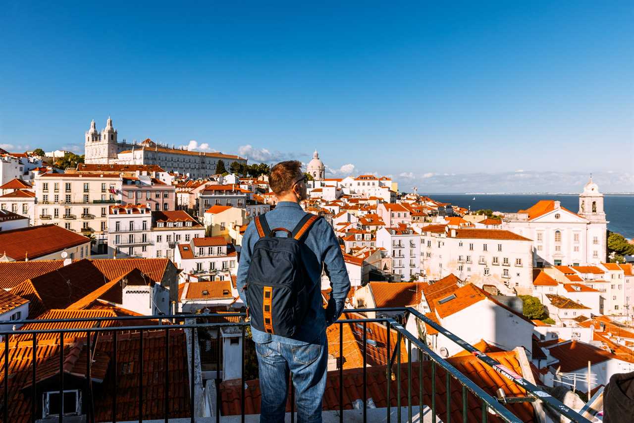 A man enjoys the view in Lisbon, Portugal.