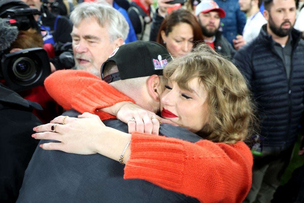 Travis Kelce #87 of the Kansas City Chiefs celebrates with Taylor Swift after a 17-10 victory against the Baltimore Ravens in the AFC Championship Game at M&T Bank Stadium on January 28, 2024 in Baltimore, Maryland