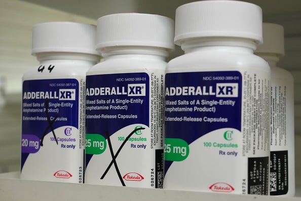 Adderall bottles sitting on a shelf