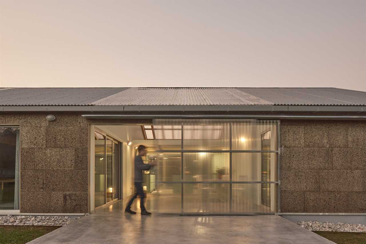 A Greenhouse Warms Up This Cork-Covered Prefab in the Spanish Countryside