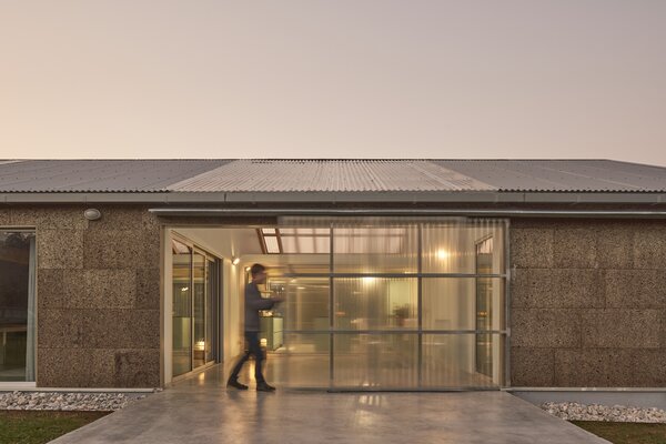 A Greenhouse Warms Up This Cork-Covered Prefab in the Spanish Countryside