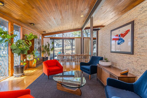 The single-story residence has an open-plan living/dining area.