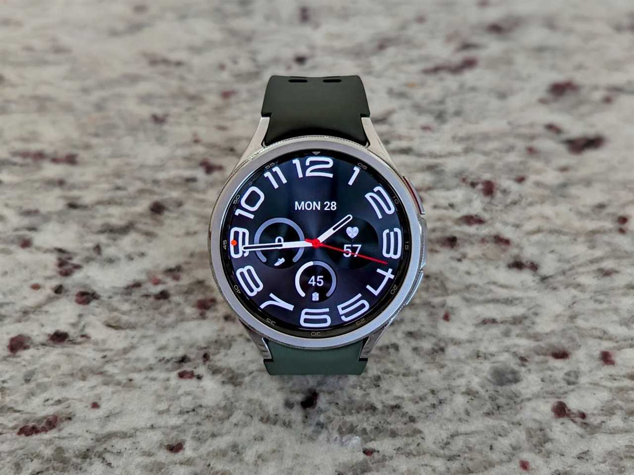 A Samsung Galaxy Watch 6 Classic sitting on a countertop.