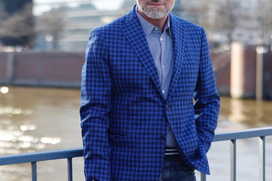 Man wearing blue checkered coat