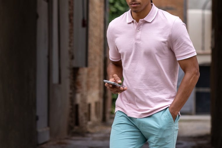 Man wearing light pink polo shirt