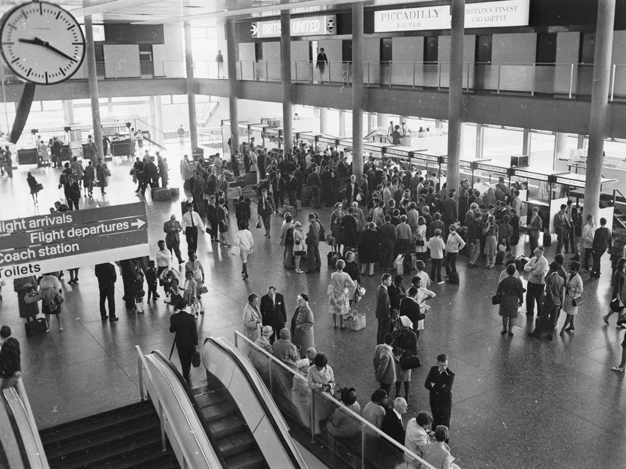 Passengers queuing at the check-in counters at Gatwick Airport in 1966