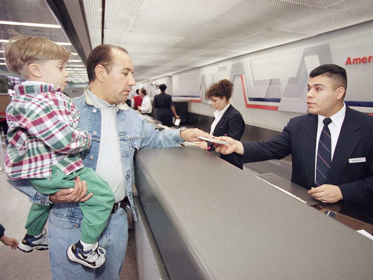 A passenger receives a boarding pass at Los Angeles International Airport in 1997.