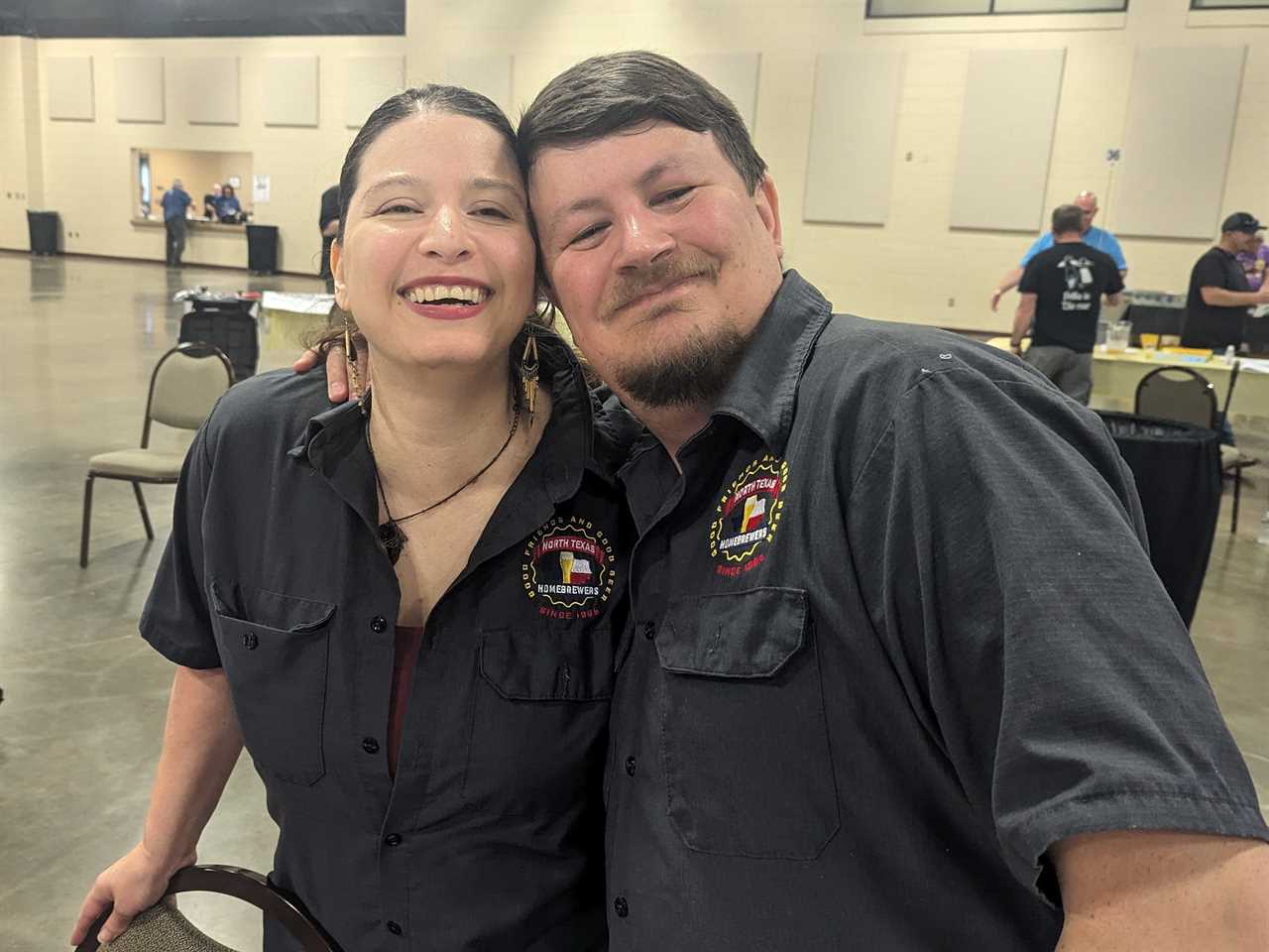 Amanda Garland and her husband smiling at the camera