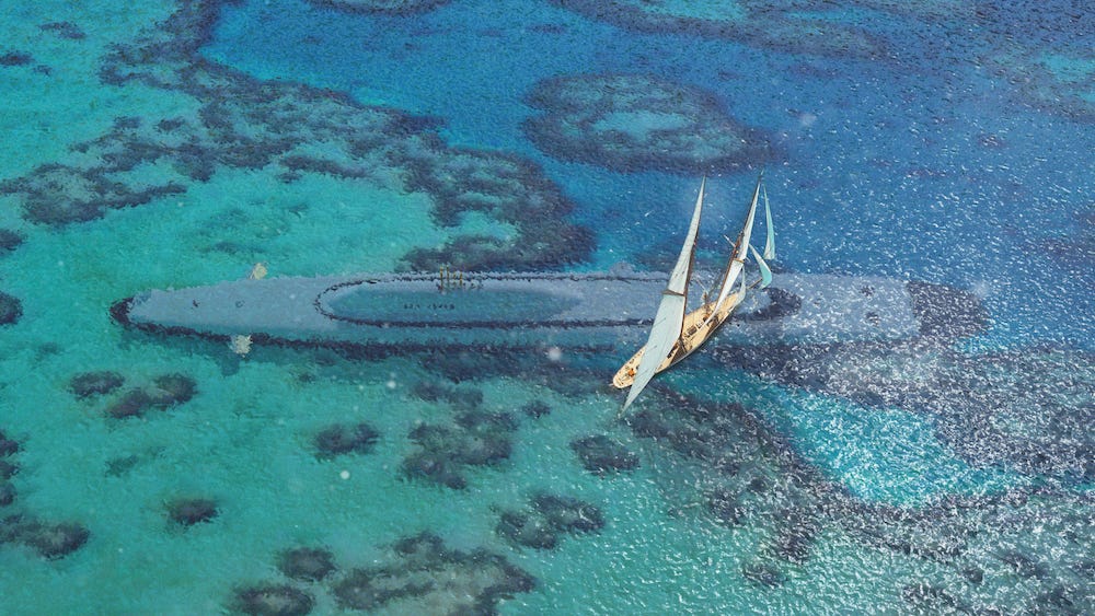 A promotional concept rendering for the proposed submersible superyacht the Migaloo M5, showing it submerged in shallow tropical waters with a sailed vessel on the surface above.