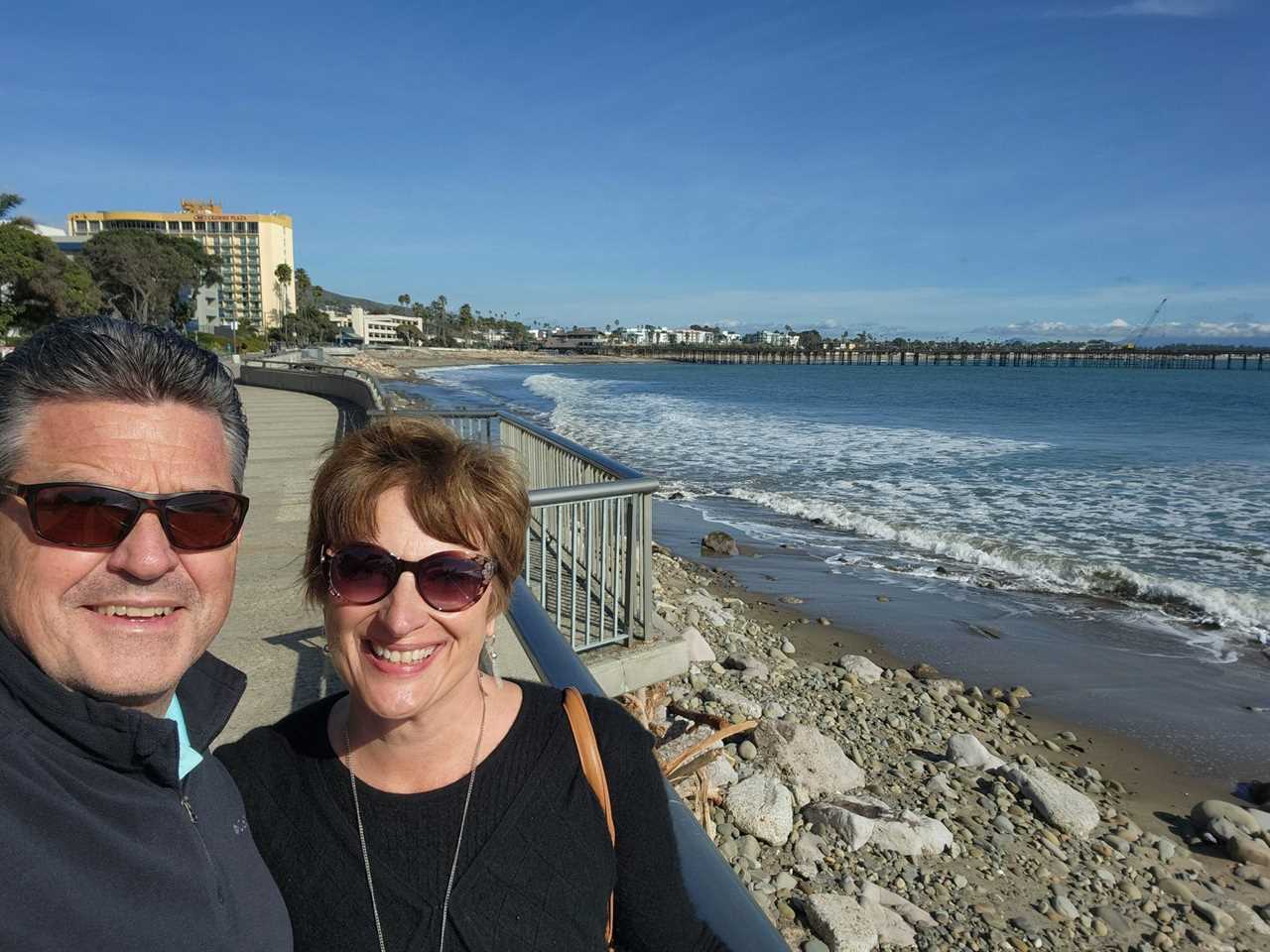 Eric and Beth Ann Mott pose at the beach