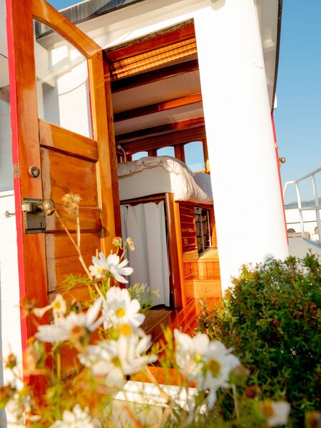 A door on the upper deck leads to the bedroom.