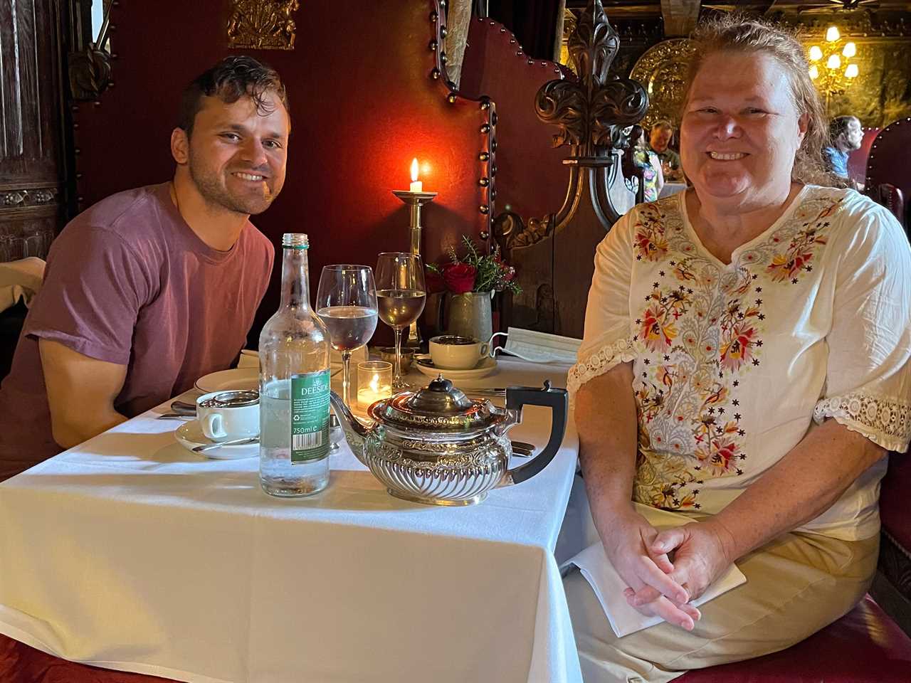 evan lambert with his mother at a table