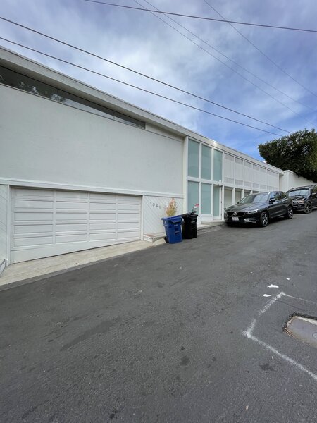 The existing home's exterior had touches of midcentury modern style.