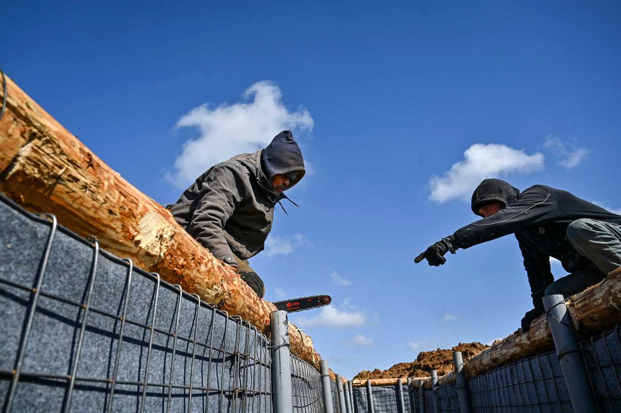 Two contractors building shelters in the Zaporizhzhia region, southeastern Ukraine