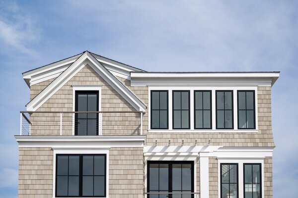 The home’s handsome exterior features cellular PVC siding—a weather-resistant, low-maintenance alternative to cedar—along with Marvin Elevate windows and doors.