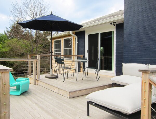 The aforementioned umbrella, table, and chairs